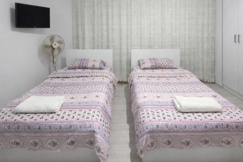 En eller flere senge i et værelse på Dr Aslan Apart Hotel