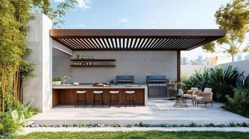 an outdoor kitchen with stools and a bar on a patio at Sayan Villas in Hikkaduwa
