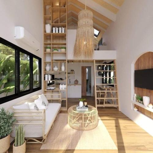 a living room with a couch and a table at Sayan Villas in Hikkaduwa