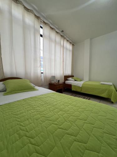 Giường trong phòng chung tại Hotel Casa Cascada