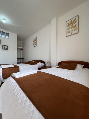 מיטה או מיטות בחדר ב-Hotel Casa Cascada