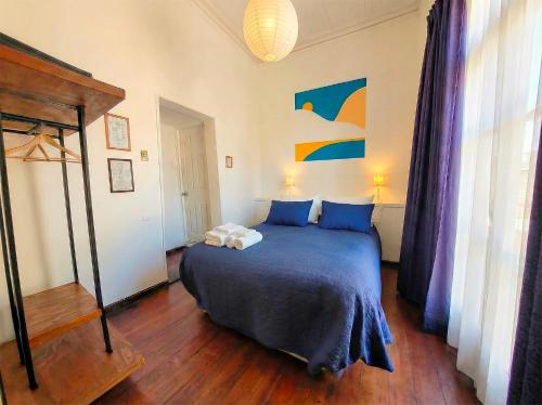 Postel nebo postele na pokoji v ubytování La Galería B&B