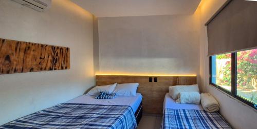 En eller flere senge i et værelse på Casa de Praia com Piscina em Maceió - Ipioca - Sauaçuhy