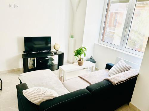 Et opholdsområde på Joli studio au cœur de village