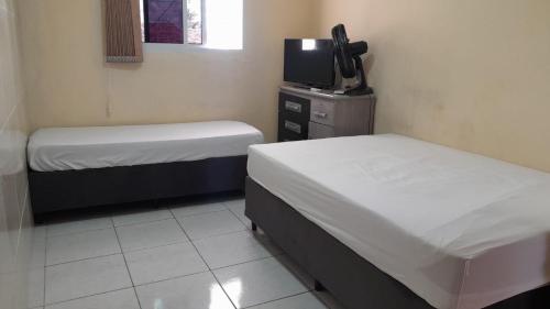 En eller flere senge i et værelse på Apto Temporada