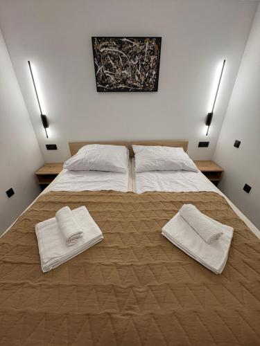 Postel nebo postele na pokoji v ubytování Osicki Sport Resort