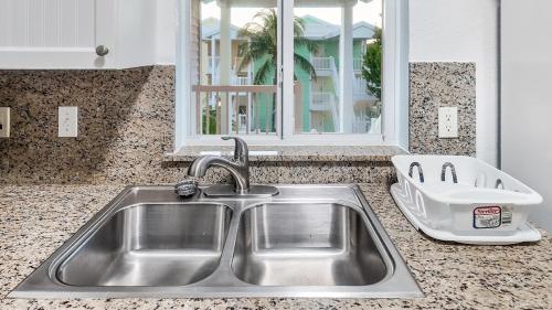 a stainless steel sink in a kitchen with a window at 2 BDM, 2 Bath - Bimini Bay Resort in Bailey Town