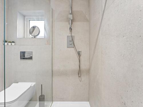 a bathroom with a shower and a sink at Spacious 3BR 3-Bath Modern Home Warrington in Warrington