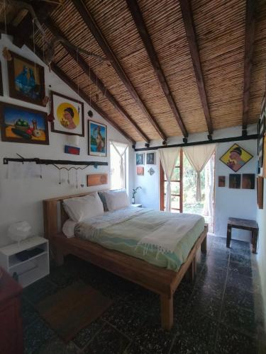 a bedroom with a bed in a room at Jacamaki- Eco-lodge & Reserva Natural in Villa de Leyva