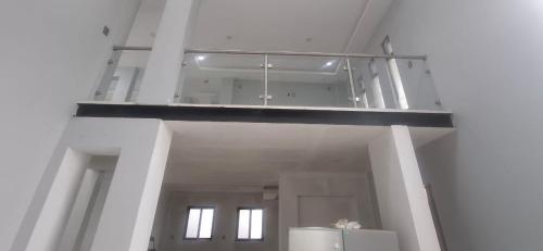 a large room with a balcony in a building at Cuarto Privado in Arandas
