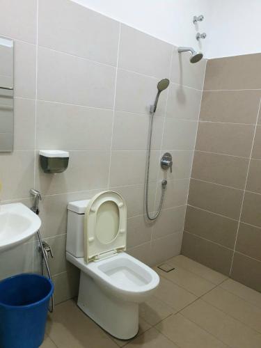 a bathroom with a toilet and a shower at 1091 LUX Conner in Port Dickson