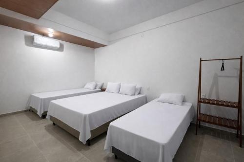 Letto o letti in una camera di Maraga Bento