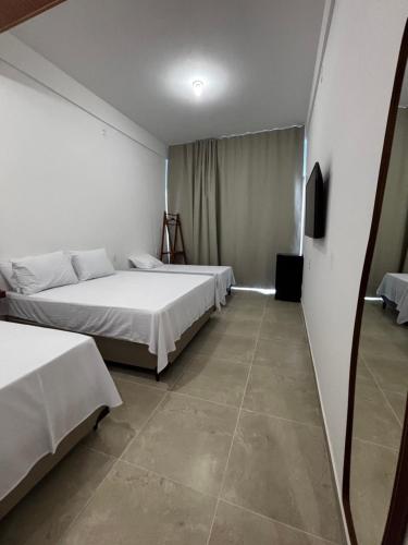 Letto o letti in una camera di Maraga Bento