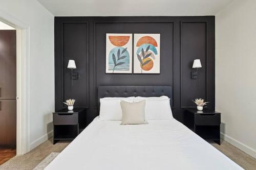 a bedroom with a large white bed with two tables at Modern 2B Close to The Star Toyota HQ Legacy West in Frisco