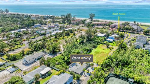 an aerial view of a town with the ocean at Starfish Sands - 580 in Longboat Key