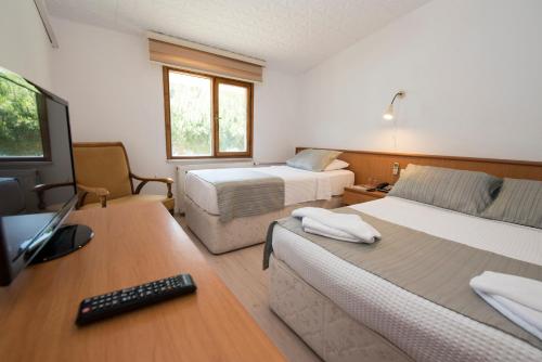 Postel nebo postele na pokoji v ubytování Otel Diyojen