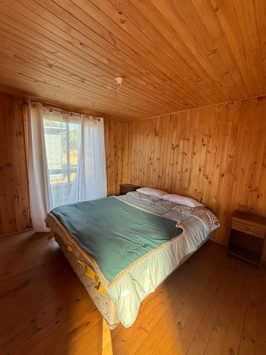 En eller flere senge i et værelse på Cabañas Vitalis