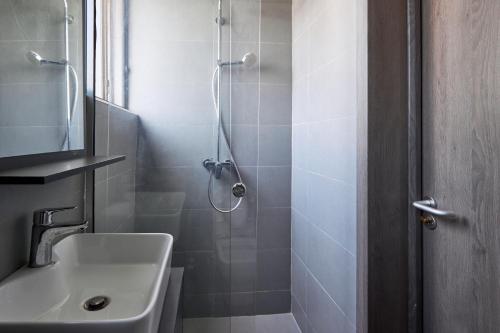 a bathroom with a shower and a sink at The Haven in Lekki