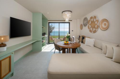 a living room with a couch and a table at Anantasila Beach Resort Hua Hin in Hua Hin