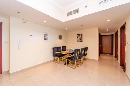 a dining room with a table and chairs at Ocean View Luxurious Homes in Ajman
