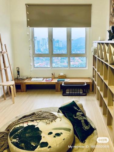 a room with a large window and a large ottoman at Simple and nice unit 3 bed 2 bath in Petaling Jaya