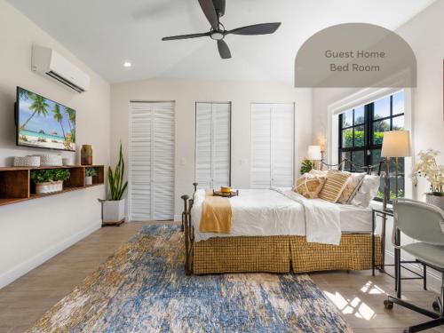 a bedroom with a bed and a ceiling fan at Spanish 4BR Compound w Casita & Private Yard in West Palm Beach