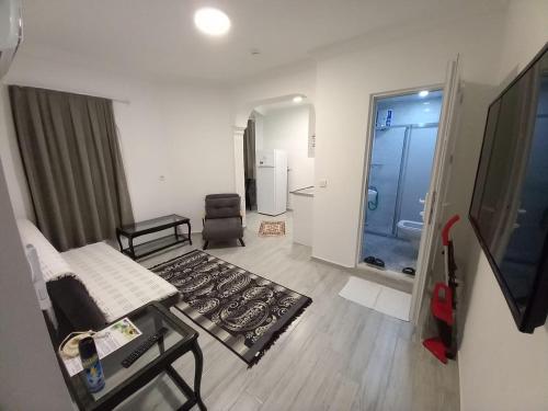 a living room with a stove top in a room at Hotel Anadolu in Finike