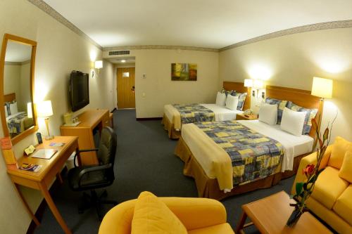 Giường trong phòng chung tại Rio Vista Inn Business High Class Hotel Poza Rica