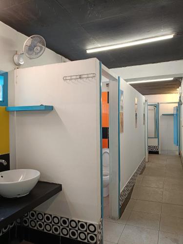 a bathroom with a sink and a toilet at Gili Beach Bum Hostel in Gili Trawangan