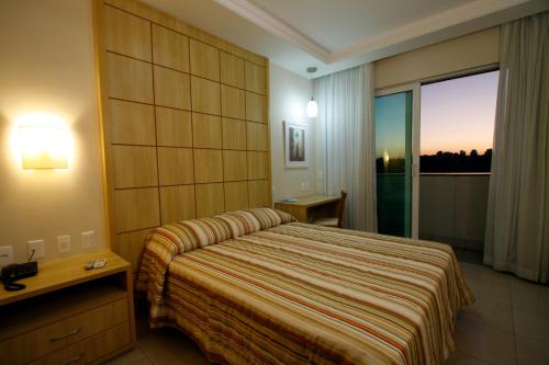 Una cama o camas en una habitación de Américas Gaivota Hotel