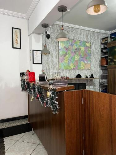 a kitchen with a counter with christmas decorations on it at Hostel Anprado #7 in Guarulhos