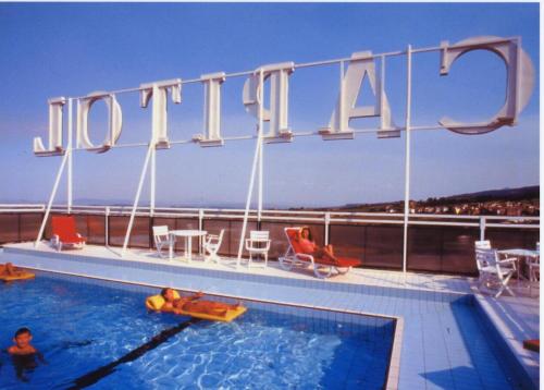 a swimming pool on the top of a cruise ship at G. Hotel Capitol in Chianciano Terme
