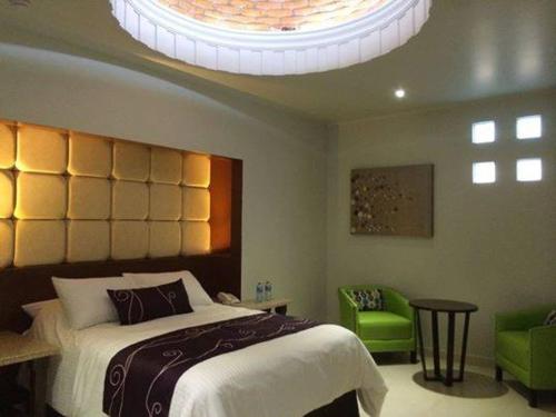 Una cama o camas en una habitación de Hotel Mumai