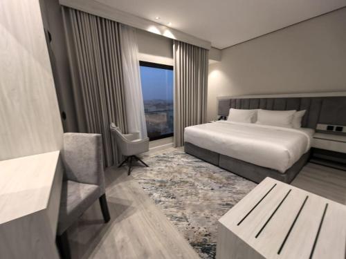 En eller flere senge i et værelse på Karim Hotel