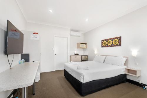 Giường trong phòng chung tại Pinjarra Resort