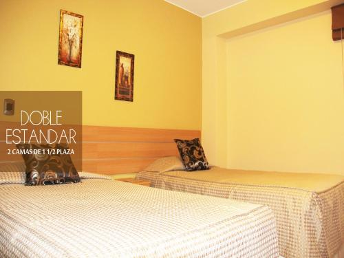 Una cama o camas en una habitación de Hotel Mochiks