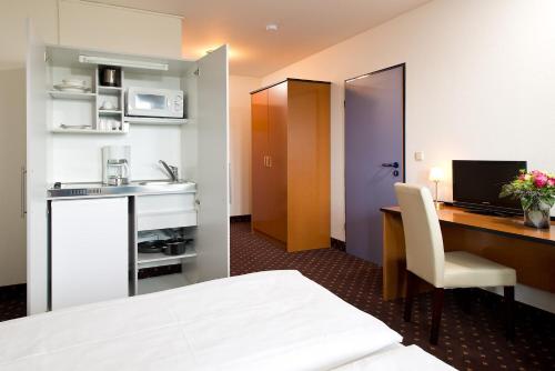 Køkken eller tekøkken på ACHAT Hotel Hockenheim