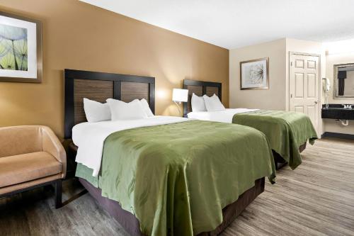 En eller flere senge i et værelse på Quality Inn Decatur River City