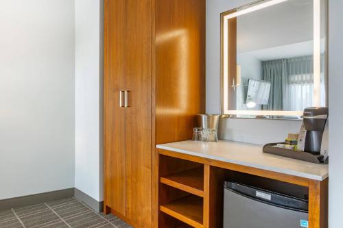 a bathroom with a sink and a mirror at Cambria Hotel LAX in El Segundo