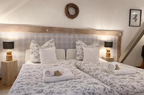 a bedroom with two beds with towels on them at Weberhof - Münster 3 in Münster