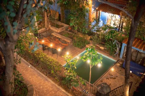 an overhead view of a garden with a pool at night at Casa Palomar in Guanajuato