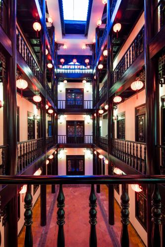a large building with a pool of water in the middle at Phu House in Phu Quoc