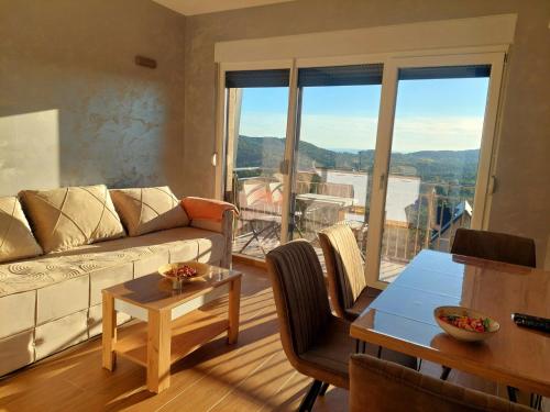 Et opholdsområde på Apartmani DIVČI Tron 9