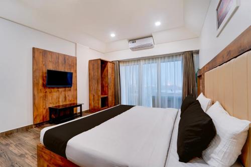 Giường trong phòng chung tại Hotel O OZONE Residency
