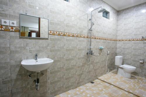 Um banheiro em Wijaya Guesthouse