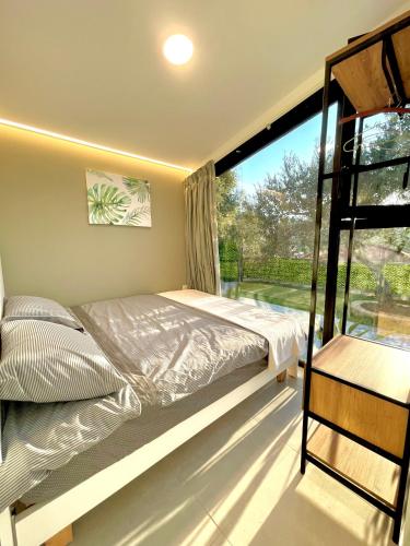 En eller flere senge i et værelse på Mit Warde Cabin