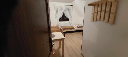 a room with a door leading to a living room at Pokoje gościnne u Sołtysów in Jurgów