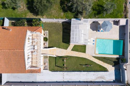 an aerial view of a house with a swimming pool at Villa Anastasis in Halikounas