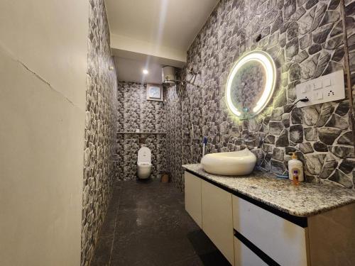 a bathroom with a sink and a toilet at Perry's Cottage in Faigul
