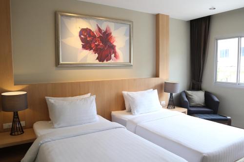 Katil atau katil-katil dalam bilik di PP Charlie Beach Resort
